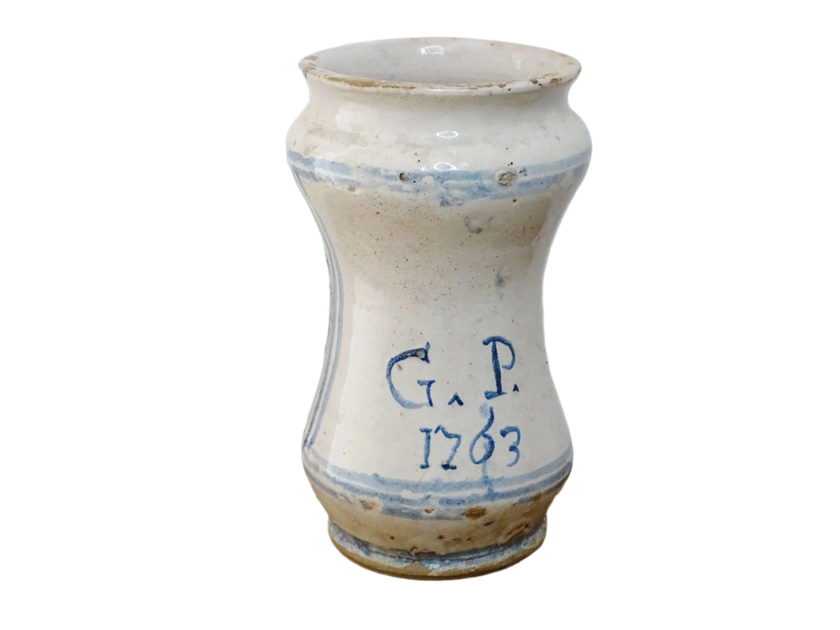 Italian albarello medicine jar from the 18th century, a tin-glazed, blue and white earthenware jar hand-painted with flowers, foliage and a naive house, dated 1763