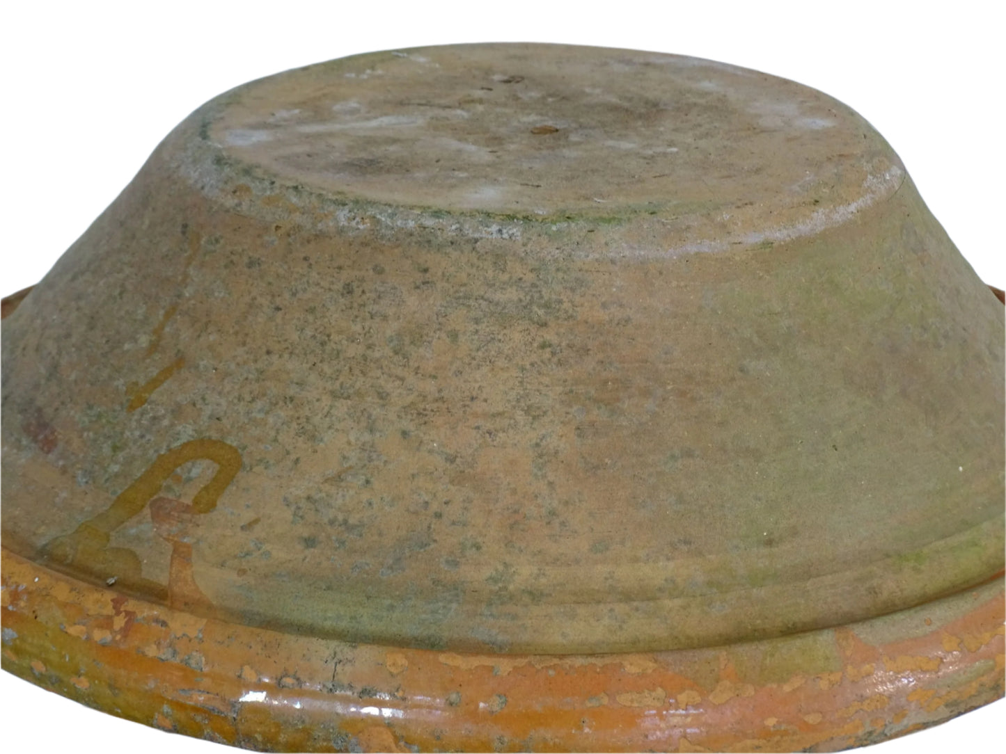 Large French antique pottery bowl with an orange glaze and blushes of green and blue. Timeworn terracotta bowl or basin has two holes in the bottom. Pottery colander or pottery strainer.