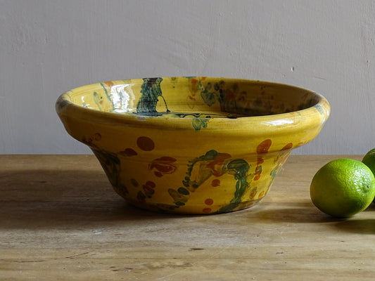 French antique jaspe pottery bowl in yellow ochre and marbled with oranges, greens and blues. Savoie pottery terracotta bowl. Antique French pottery or antique slipware pottery.