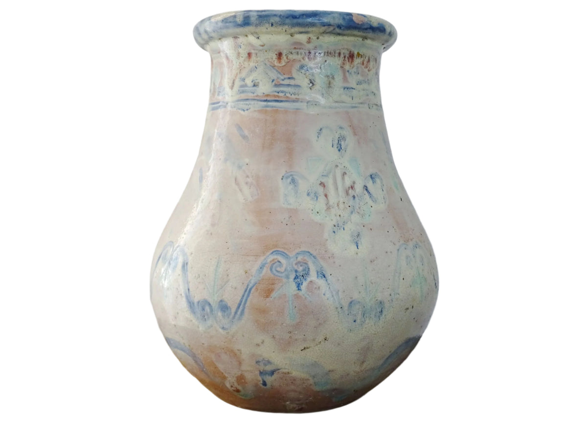 An antique French terracotta baluster vase glazed in soft pink and blue with touches of turquoise. This earthenware vase has a broad lip and a crazed patina. Pink pottery vase.