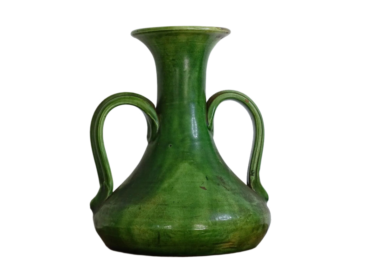 French antique art nouveau pottery vase with a green glaze in a deep tone with splashes of soft yellow. Organic in shape, this twin handled antique vase has an elongated neck