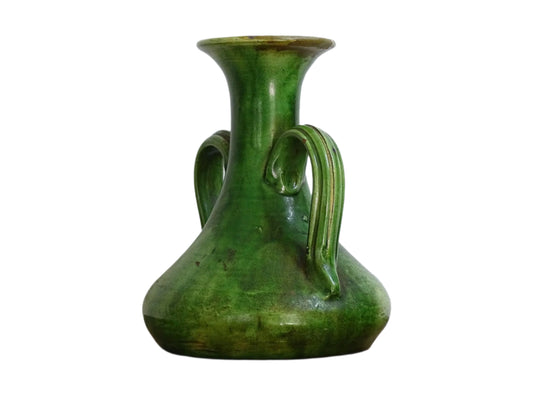 French antique art nouveau pottery vase with a green glaze in a deep tone with splashes of soft yellow. Organic in shape, this twin handled antique vase has an elongated neck
