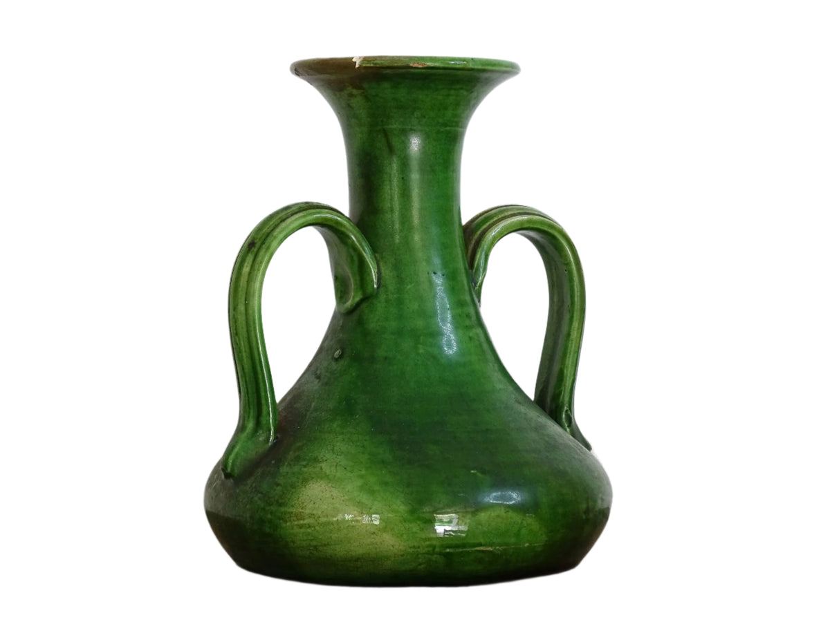 French antique art nouveau pottery vase with a green glaze in a deep tone with splashes of soft yellow. Organic in shape, this twin handled antique vase has an elongated neck
