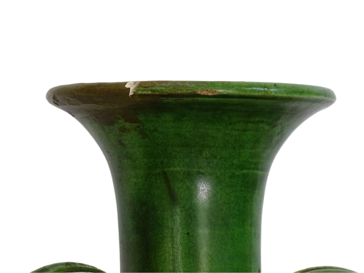 French antique art nouveau pottery vase with a green glaze in a deep tone with splashes of soft yellow. Organic in shape, this twin handled antique vase has an elongated neck