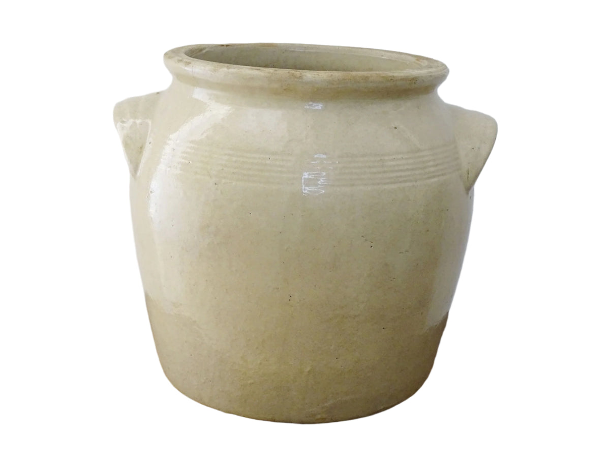 Rustic antique French stoneware confit pot. Glazed pottery cache pot in a pale oatmeal glaze. French farmhouse style home decor.