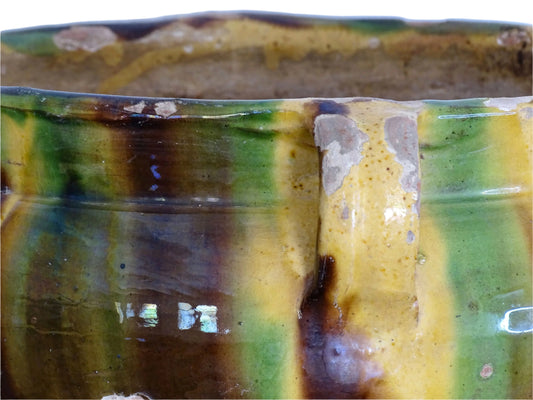 French antique terracotta planter with a stripe drip glaze in yellow, green and brown . Pottery planter from Castelnaudary. Antique ceramic jardinière or ceramic cachepot.