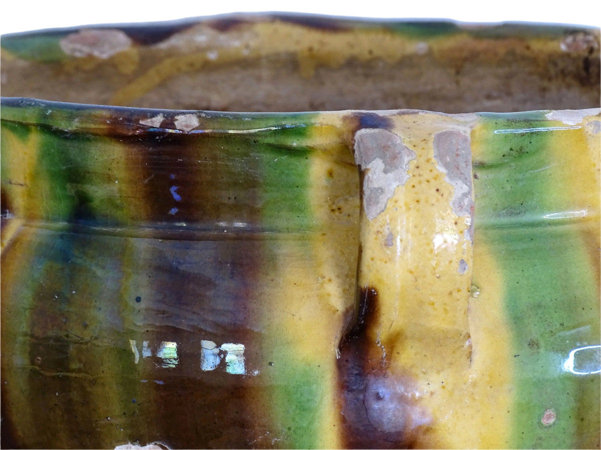 French antique terracotta planter with a stripe drip glaze in yellow, green and brown . Pottery planter from Castelnaudary. Antique ceramic jardinière or ceramic cachepot.