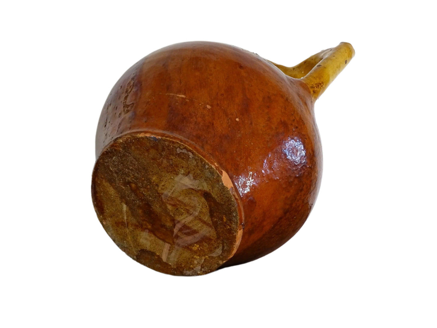 French antique pottery pitcher or orjol with golden caramel and yellow glaze. Antique terracotta cruche or jug with timeworn appearance.