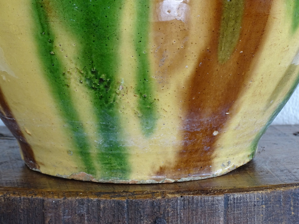 French antique ceramic planter from Castelnaudary, this antique cache pot is in glazed terracotta with green, yellow and brown.
