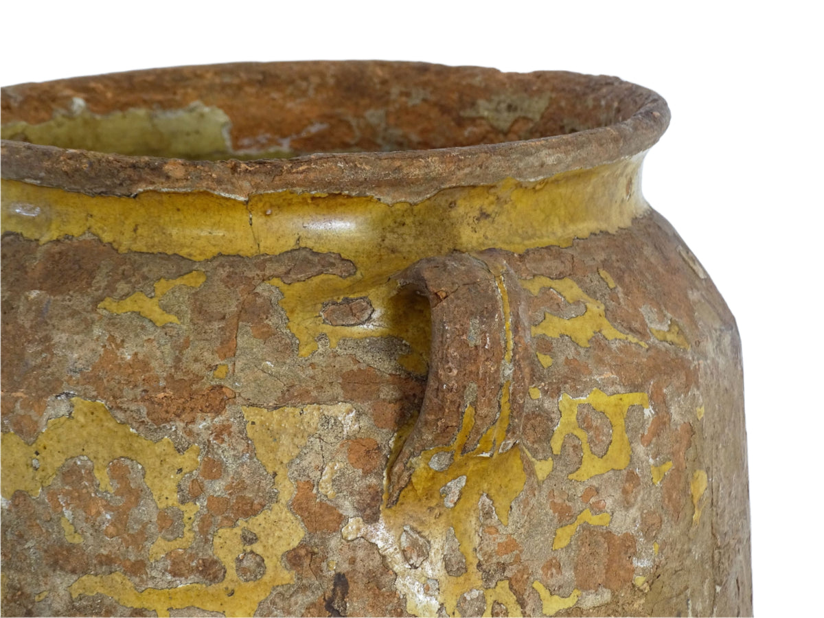 Antique French confit pot with yellow glaze, a large rustic terracotta pot or confit jar from the South of France.