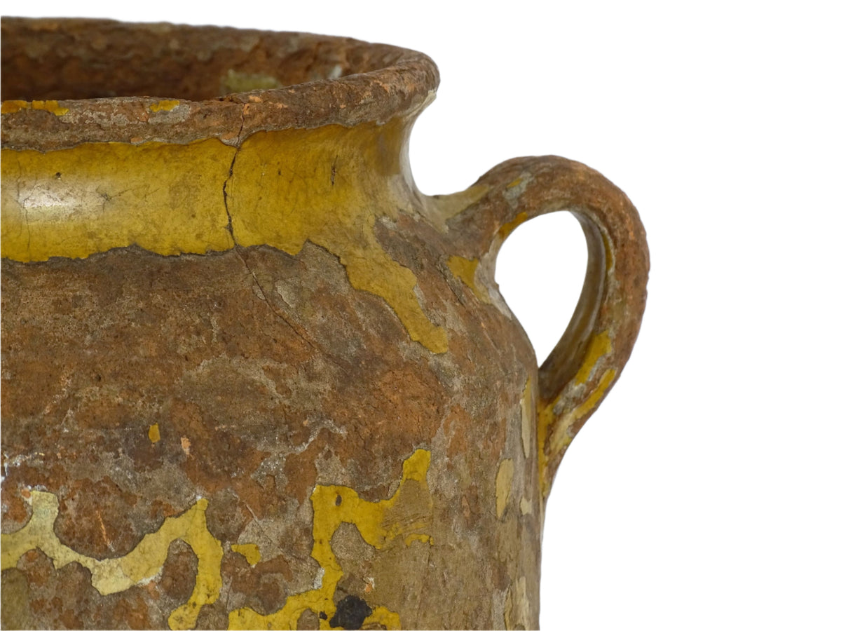 Antique French confit pot with yellow glaze, a large rustic terracotta pot or confit jar from the South of France.