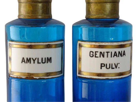French antique blue glass apothecary bottles or antique medicine bottles with brass tops and ceramic labels
