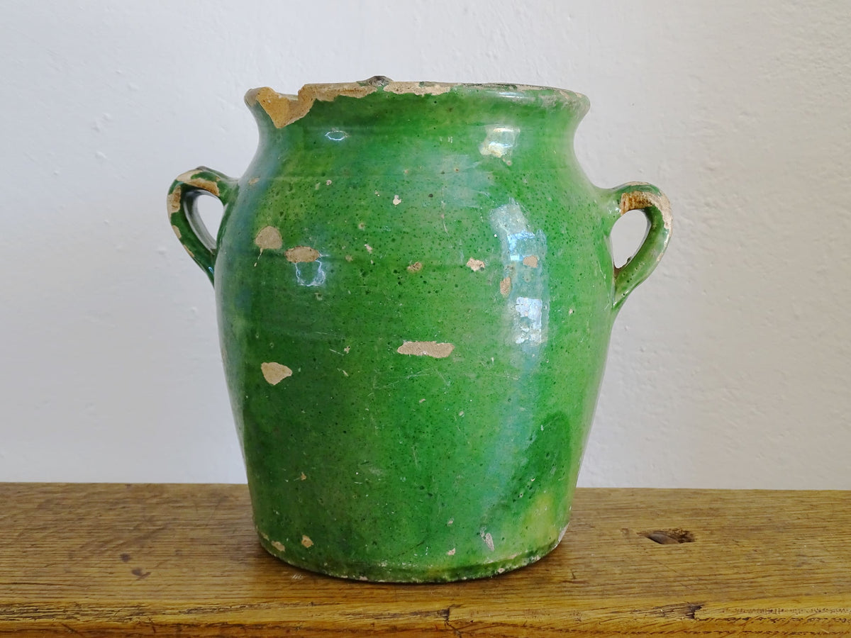 French antique confit pot with green glaze and yellow glazed interior. Green confit pot with two handles