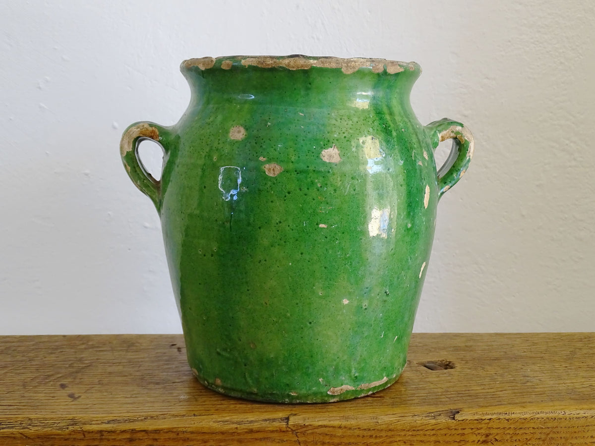 French antique confit pot with green glaze and yellow glazed interior. Green confit pot with two handles