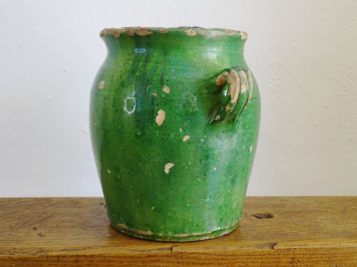 French antique confit pot with green glaze and yellow glazed interior. Green confit pot with two handles