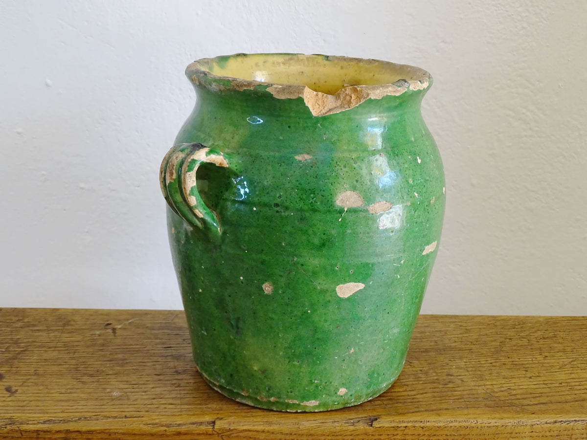 French antique confit pot with green glaze and yellow glazed interior. Green confit pot with two handles