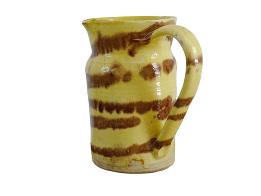 Rustic French antique ceramic jug with a yellow glaze with brown drip glaze detailing. Pottery jug from Dieulefit. Rustic French pottery for a French farmhouse aesthetic.