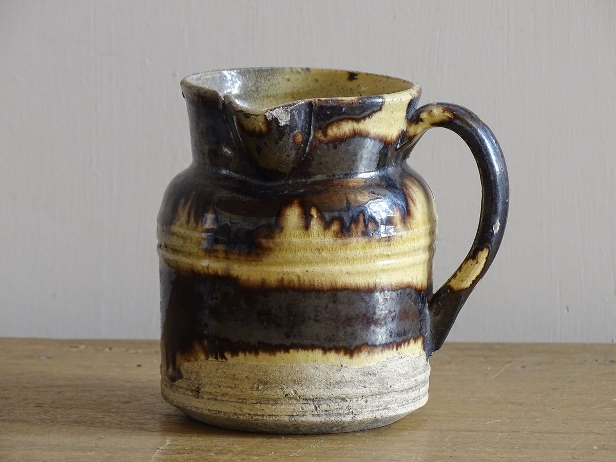 French antique ceramic pitcher with brown and yellow glaze