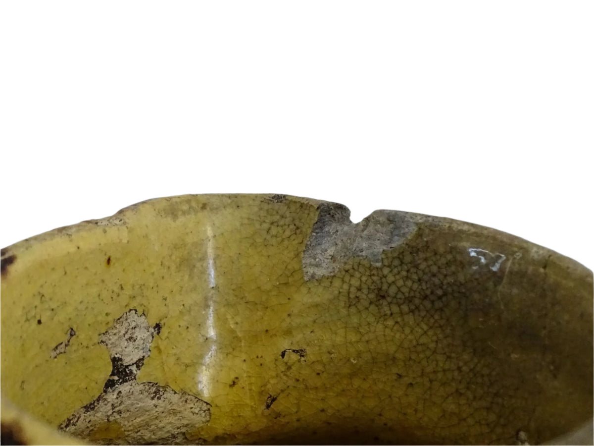French antique ceramic jug from Dieulefit with brown drip glaze and yellow glazed background.