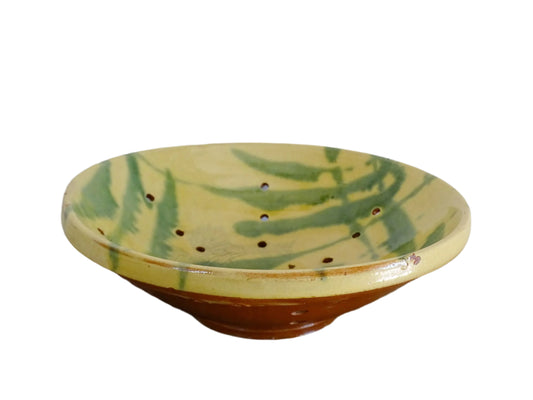 French antique ceramic colander with a yellow and green glaze. Pottery colander for berries.