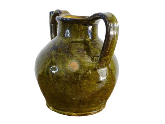 French antique cruche or orjol with an earthy green glaze. Antique terracotta water jug from the Languedoc with a timeworn appearance. French farmhouse aesthetic.
