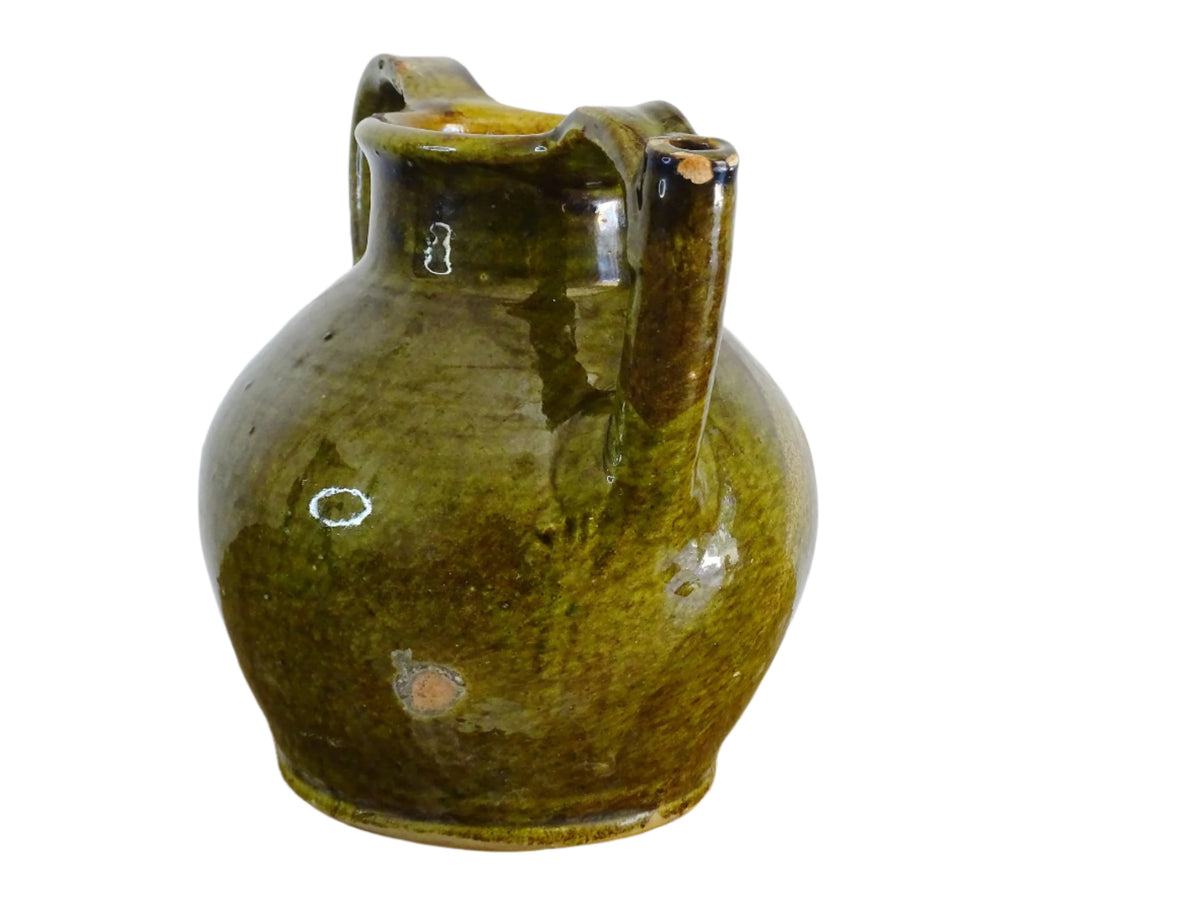French antique cruche or orjol with an earthy green glaze. Antique terracotta water jug from the Languedoc with a timeworn appearance. French farmhouse aesthetic.