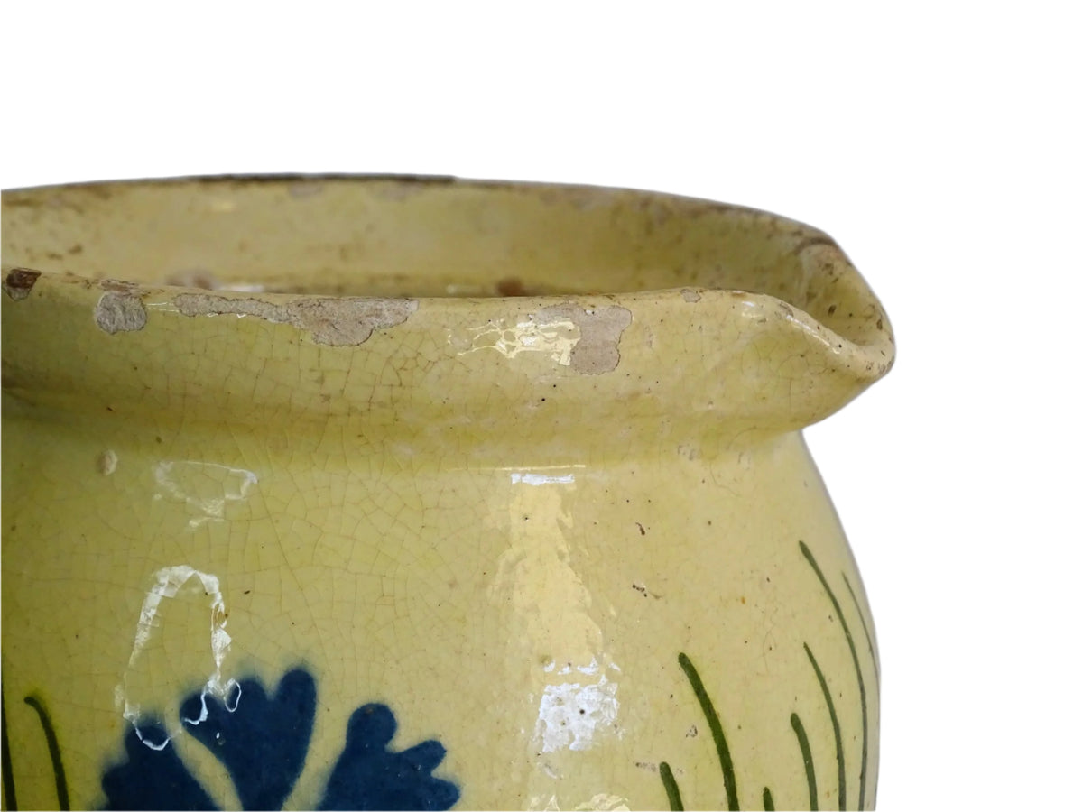 French antique pottery jug with hand painted flowers. Yellow glazed pitcher with blue flowers for a French farmhouse or cottagecore kitchen.