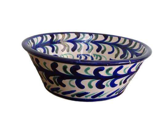 Vintage Spanish Fajalauza pottery bowl with blue and green hand painted pattern and pomegranate to the centre.