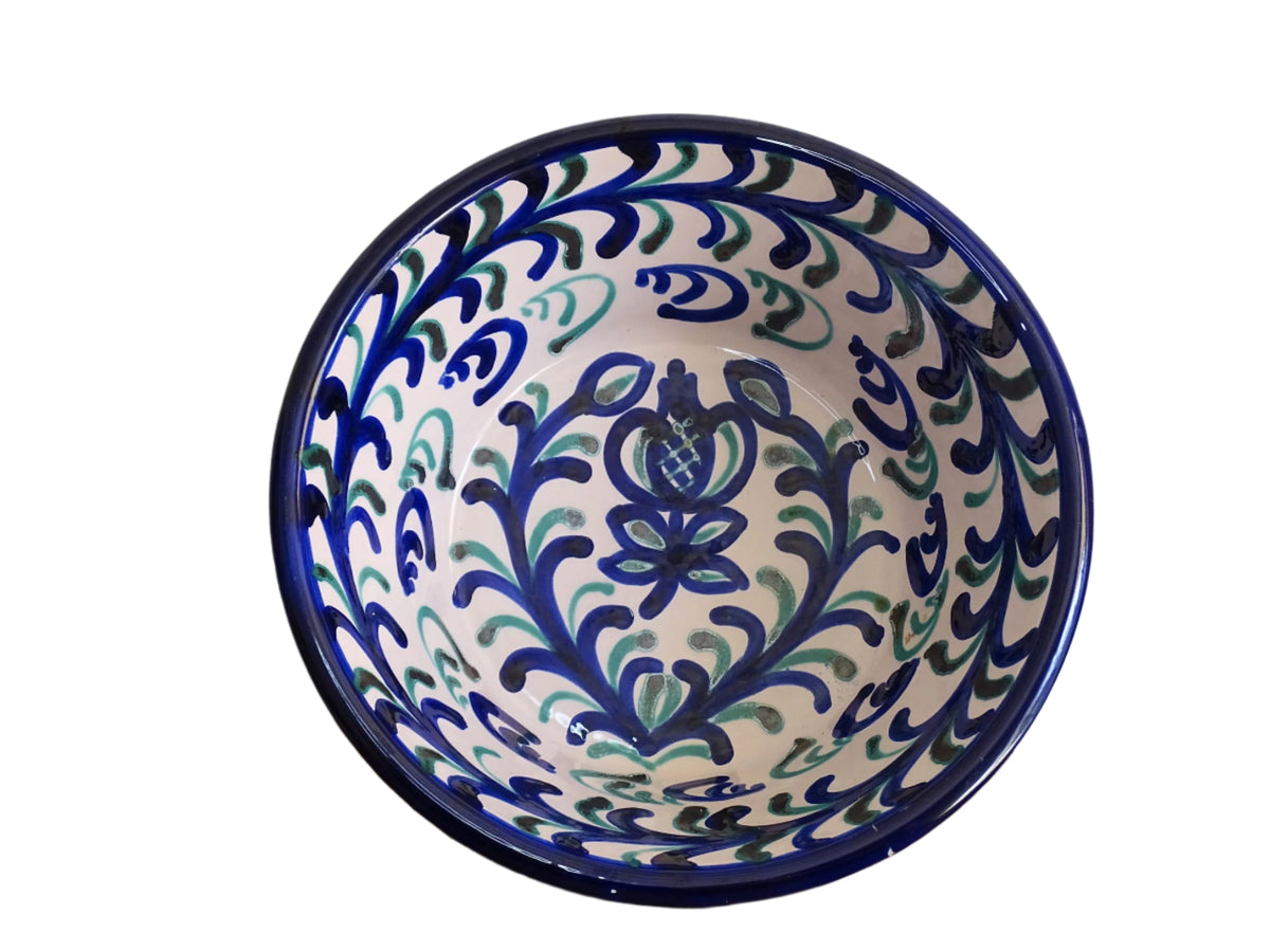 Vintage Spanish Fajalauza pottery bowl with blue and green hand painted pattern and pomegranate to the centre.