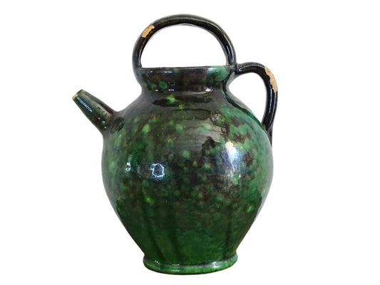 French antique pottery gargoulette with black and green glaze. Glazed ceramic water jug has a handle to the top and side, as well as a spout.