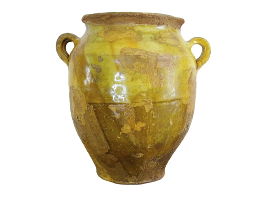 Large antique French confit pot with yellow glaze. Old terracotta pot with a rich patina and has touches of green over the mustard yellow. Yellow confit jar with two handles, farmhouse pottery for a French country farmhouse decor.