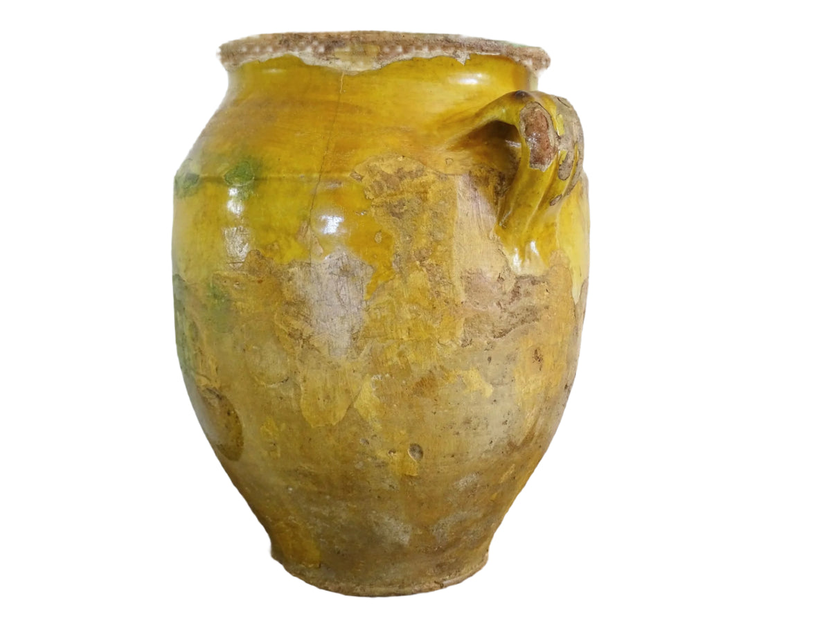 Large antique French confit pot with yellow glaze. Old terracotta pot with a rich patina and has touches of green over the mustard yellow. Yellow confit jar with two handles, farmhouse pottery for a French country farmhouse decor.