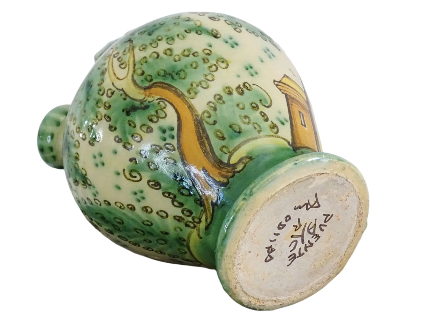Decorated Spanish vintage gargoulette with a green and ochre yellow glaze. Puente Del Arzobispo pottery water pitcher is hand-painted with trees, a castle and flowers. It has a handle to the top, as well as two spouts. Ceramic pitcher or glazed terracotta jug.
