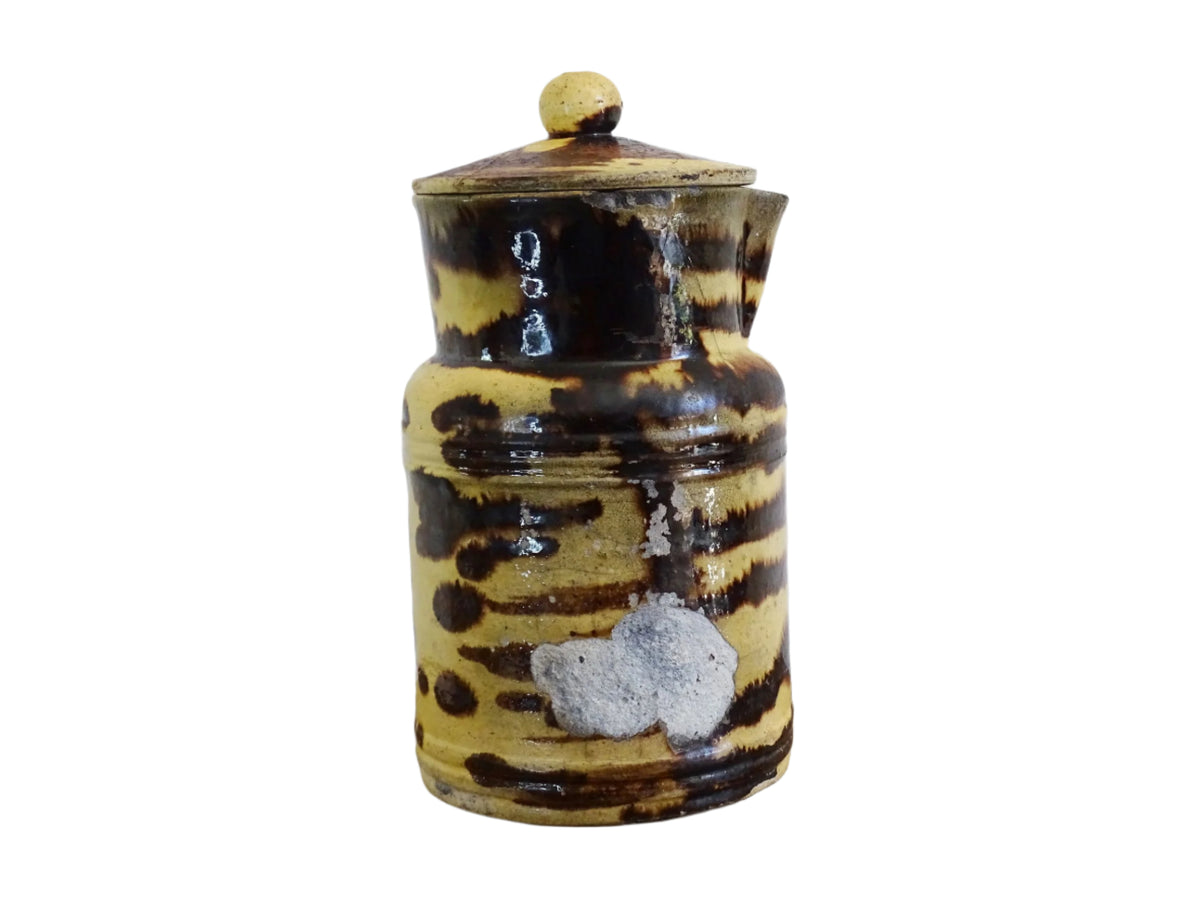 Large French antique pottery pitcher with a lid. Glazed ceramic pitcher with a brown drip glaze on a yellow glazed background. Dieulefit pottery pitcher or Savoie pottery jug.