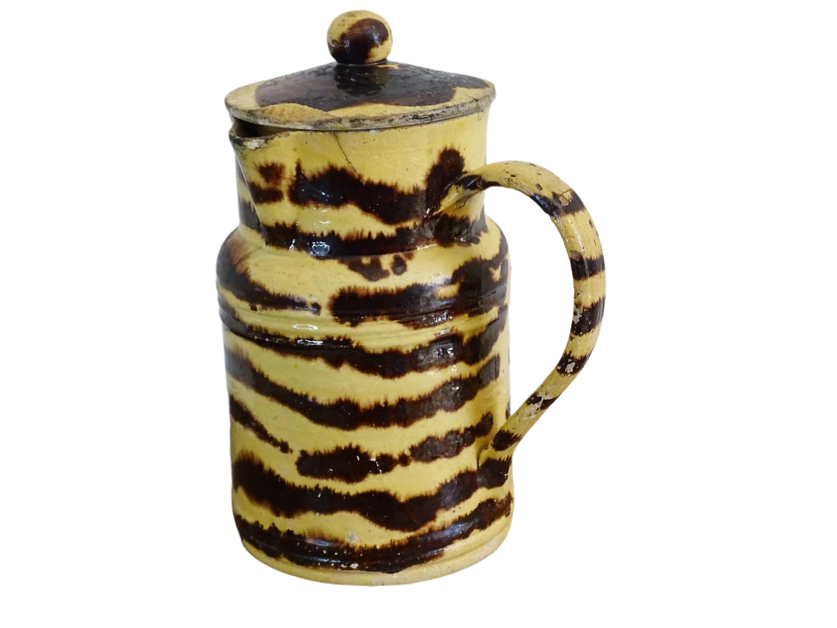 Large French antique pottery pitcher with a lid. Glazed ceramic pitcher with a brown drip glaze on a yellow glazed background. Dieulefit pottery pitcher or Savoie pottery jug.