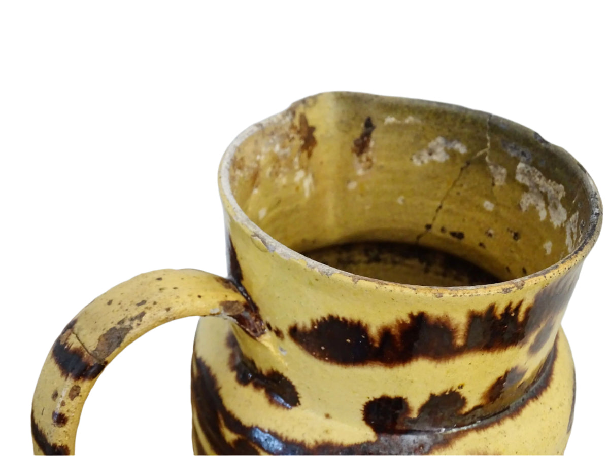 Large French antique pottery pitcher with a lid. Glazed ceramic pitcher with a brown drip glaze on a yellow glazed background. Dieulefit pottery pitcher or Savoie pottery jug.