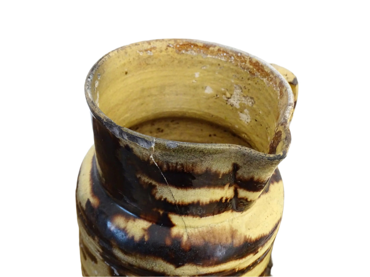 Large French antique pottery pitcher with a lid. Glazed ceramic pitcher with a brown drip glaze on a yellow glazed background. Dieulefit pottery pitcher or Savoie pottery jug.