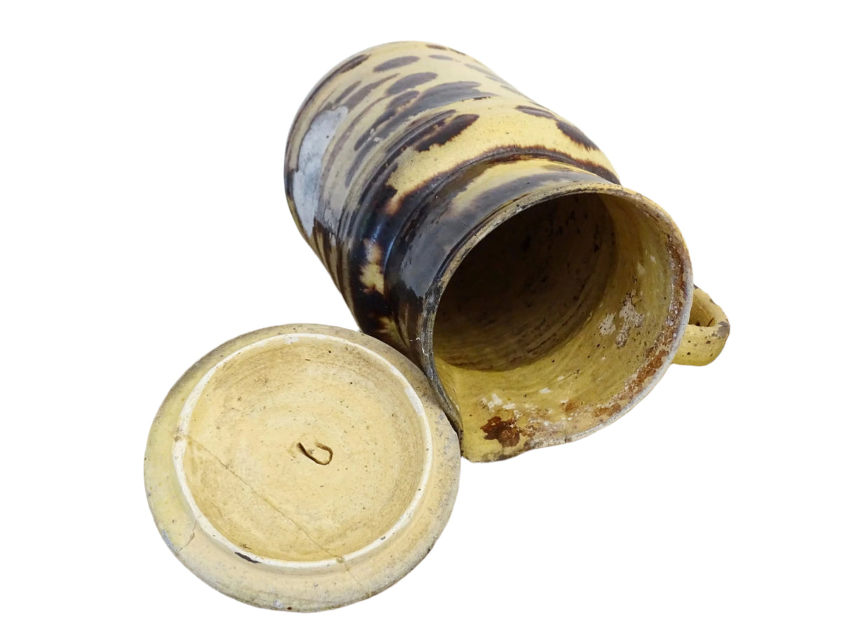 Large French antique pottery pitcher with a lid. Glazed ceramic pitcher with a brown drip glaze on a yellow glazed background. Dieulefit pottery pitcher or Savoie pottery jug.