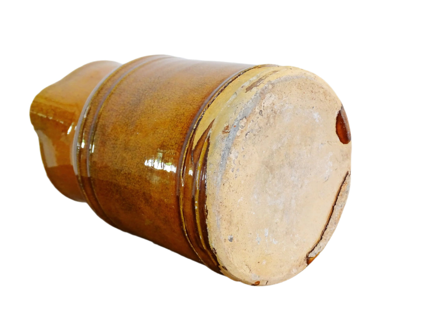 Rustic French antique pottery jug with an orange glaze. Glazed ceramic pitcher from Savoie. Savoyard pottery jug with a handle and spout.