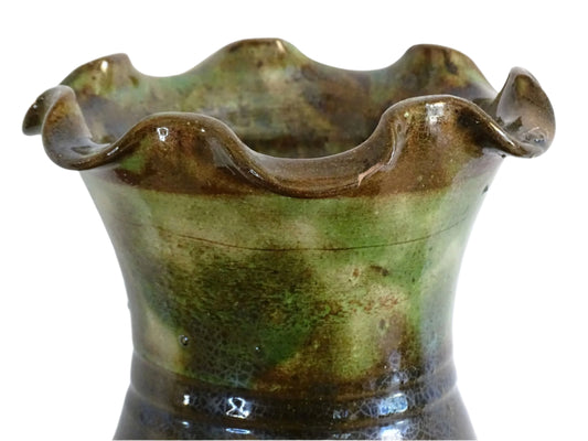 French vintage glazed terracotta vase from Castelnaudary. The ceramic vase has a textured green and brown glaze. It has a crimped rim and crackled glaze on the lower portion. Pottery vase for farmhouse decor.