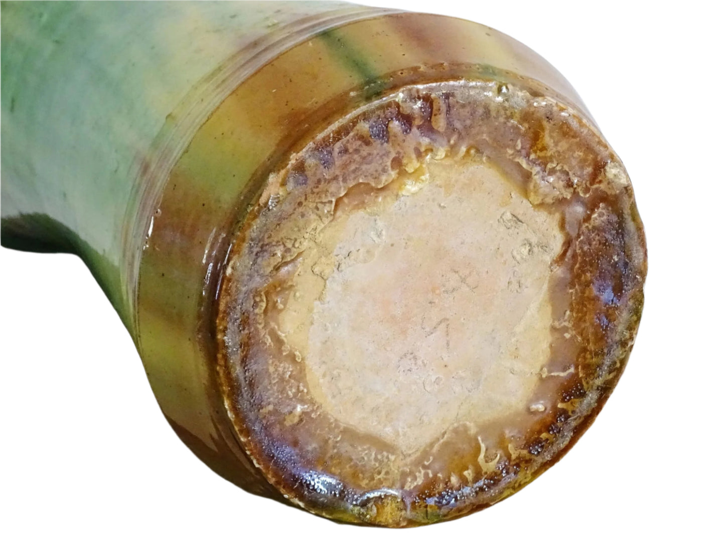 French antique pottery vase from the town of Castelnaudary. Glazed terracotta vase with a flared shape and glaze in shades of green, yellow, and earthy brown. Tall ceramic vase with dripping glaze effect for French countryside decor.