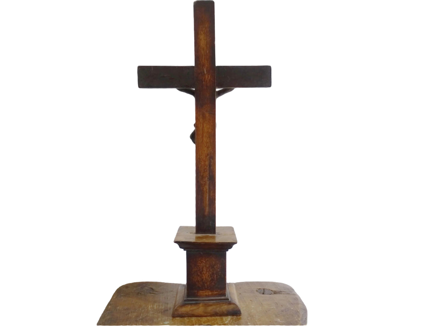 A French antique altar crucifix featuring a wooden cross with a spelter figure of Christ, mounted on a tiered wooden base. The wood has a rich patina.