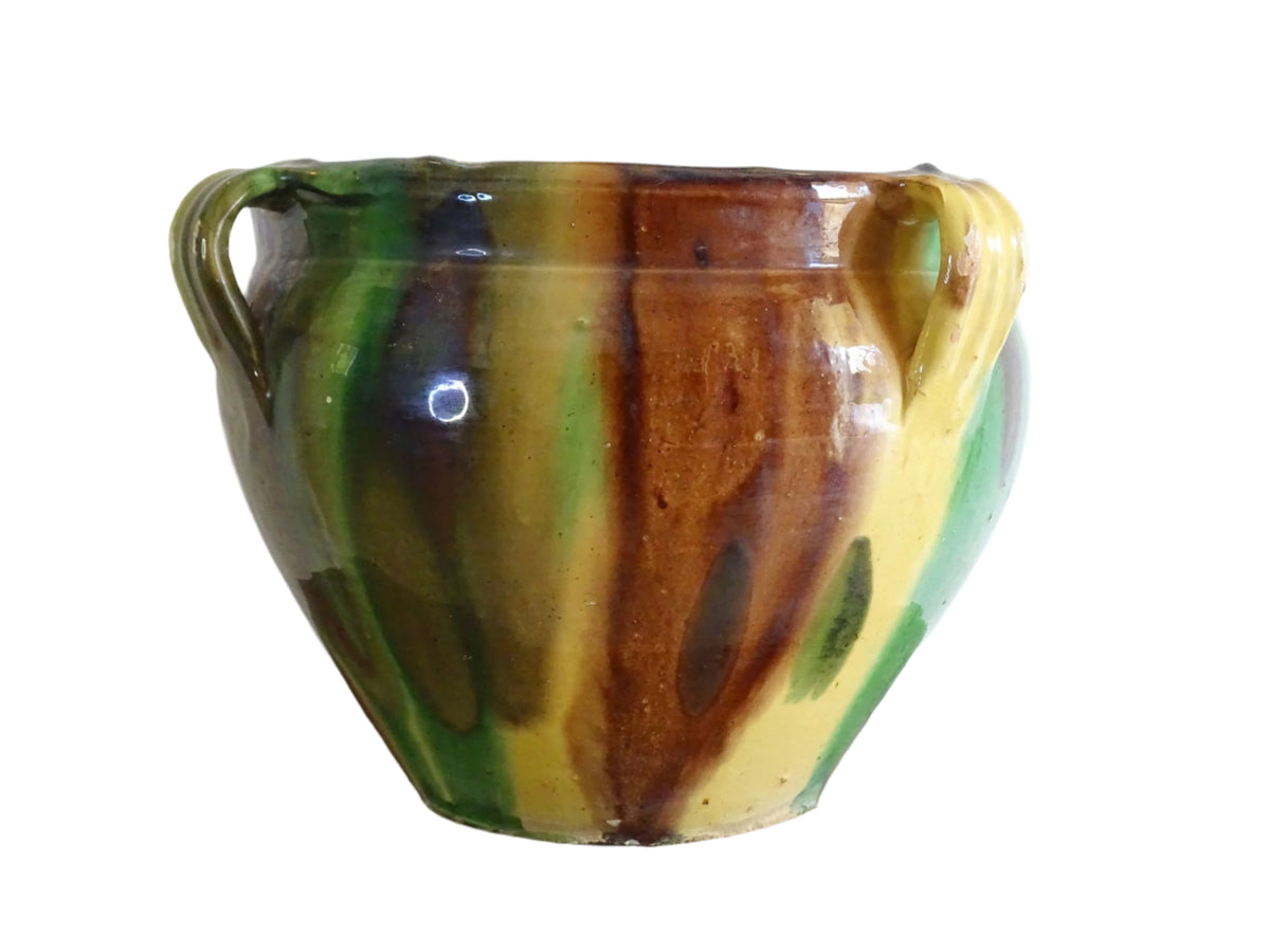 French antique ceramic planter from Castelnaudary. Pottery pot with a stripe drip glaze in yellow, green and brown. This antique cache pot in terracotta.