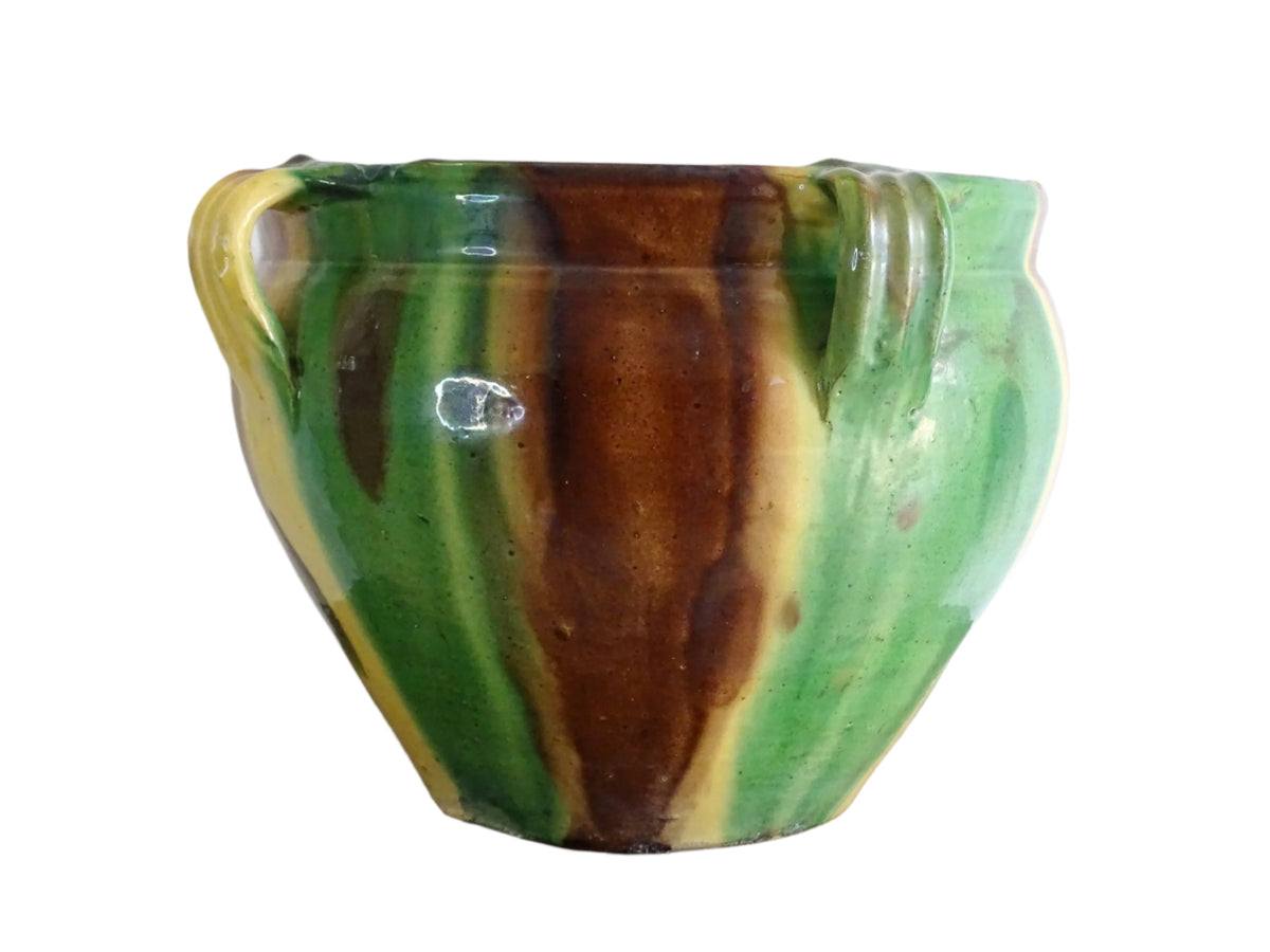 French antique ceramic planter from Castelnaudary. Pottery pot with a stripe drip glaze in yellow, green and brown. This antique cache pot in terracotta.