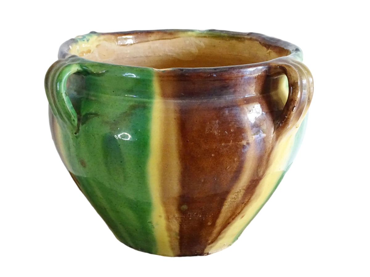 French antique ceramic planter from Castelnaudary. Pottery pot with a stripe drip glaze in yellow, green and brown. This antique cache pot in terracotta.