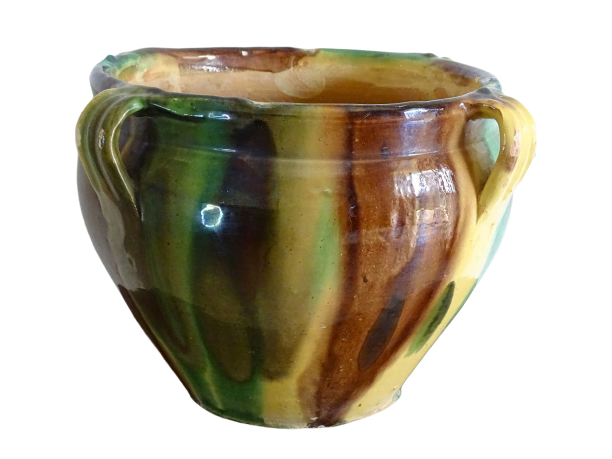 French antique ceramic planter from Castelnaudary. Pottery pot with a stripe drip glaze in yellow, green and brown. This antique cache pot in terracotta.