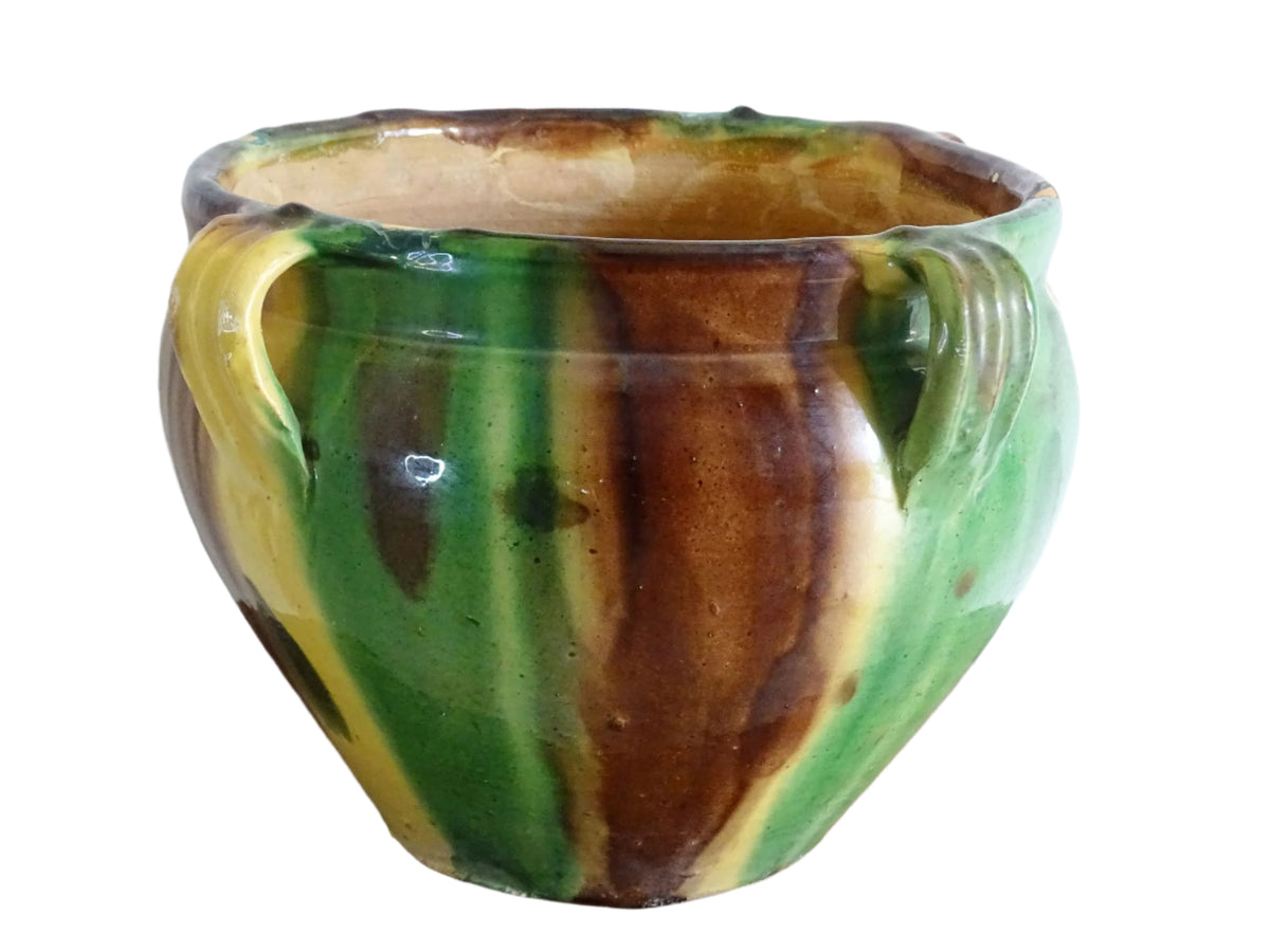 French antique ceramic planter from Castelnaudary. Pottery pot with a stripe drip glaze in yellow, green and brown. This antique cache pot in terracotta.