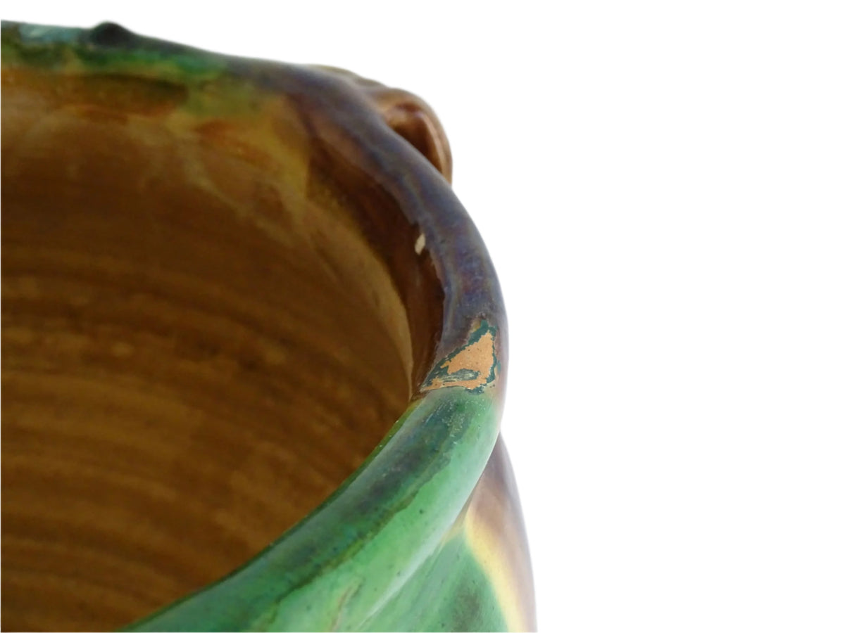 French antique ceramic planter from Castelnaudary. Pottery pot with a stripe drip glaze in yellow, green and brown. This antique cache pot in terracotta.