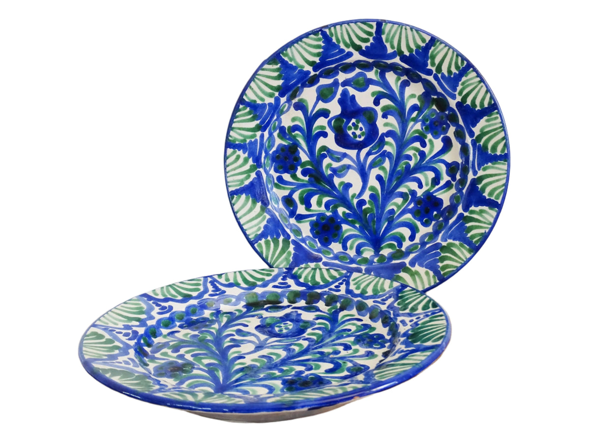 Pair of Spanish vintage Fajalauza plates, hand-painted in green and blue, decorated with flowers, leaves and pomegranates. Tin glazed terracotta plates for wall decor.