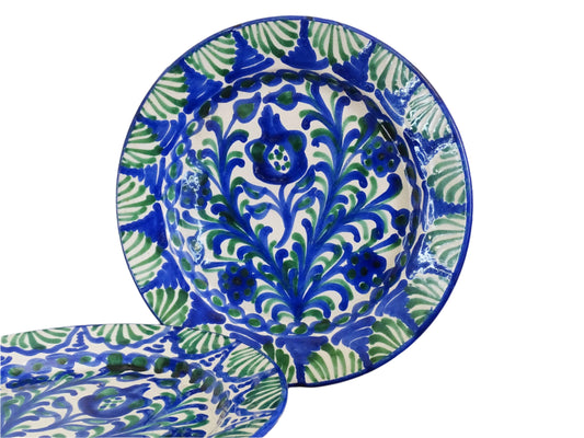Pair of Spanish vintage Fajalauza plates, hand-painted in green and blue, decorated with flowers, leaves and pomegranates. Tin glazed terracotta plates for wall decor.